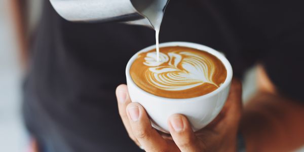 barista making latte